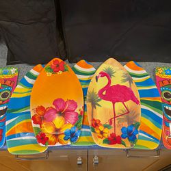7 gently used luau hawaiian party serving platters.  5 shaped like surf boards and 2 shaped tiki