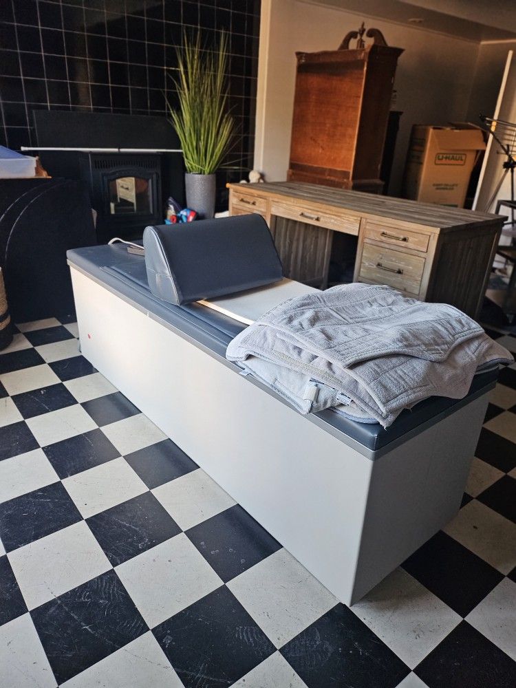 Heat and traction table from a Chiropractic office.