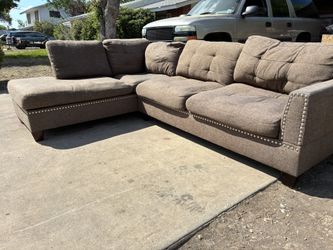 Brown Studed Sectional **FREE DELIVERY*+