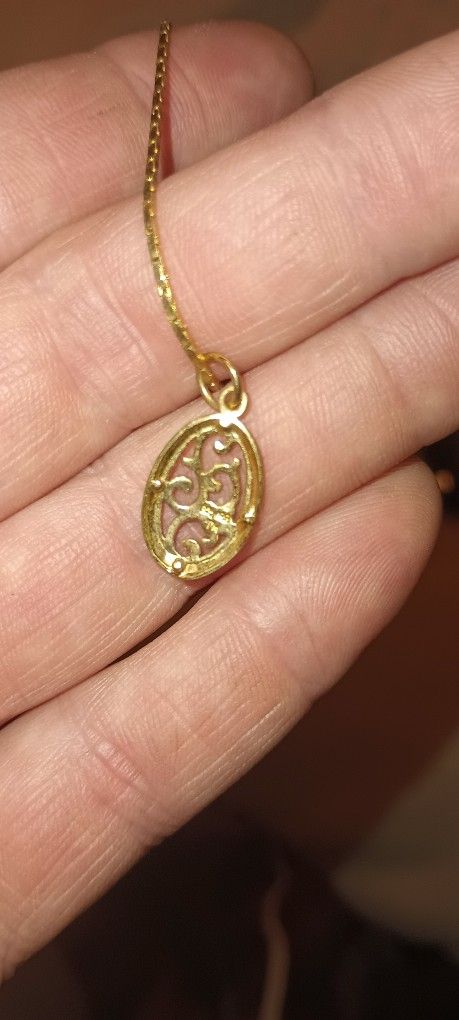 Gold Necklace And Charm