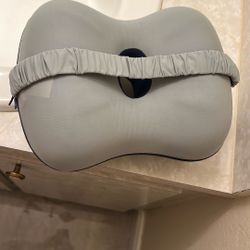  grey Derila memory foam pillow, which is designed for neck support during sleep or travel.  