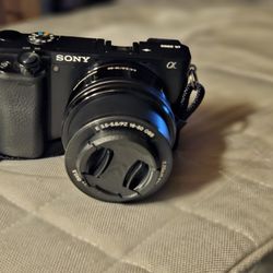 Sony a6000 with 16-50 lens, 3 batteries charger and power adapter.