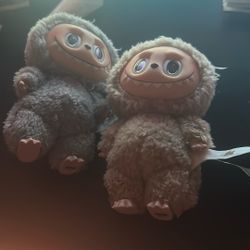 labubus, grey one $30 the brown one $25