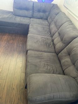 Gray Sectional Sofa with white stitching animal free
