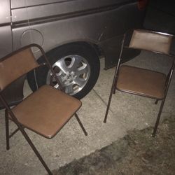 Two very nice metal fold up cushion chairs both only $20 firm