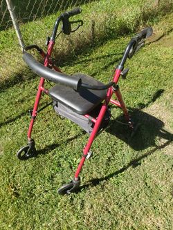 WALKER WITH WHEELS AND SEAT AND BRAKES. REDUCE TO 40.00