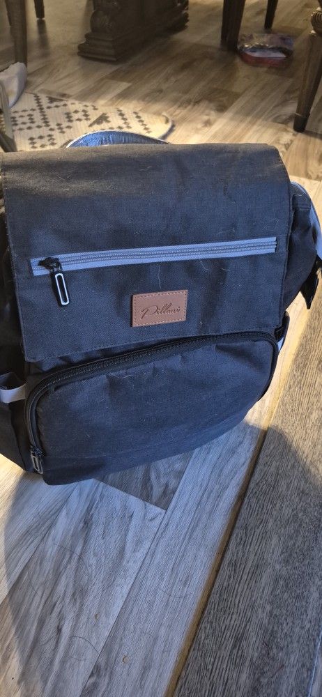 Diaper backpack with changing station