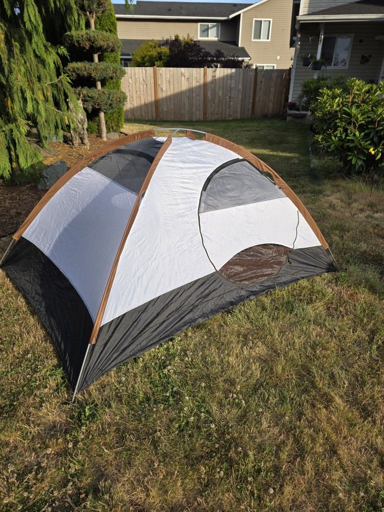 Compact lightweight backpacking or motorcycle tent with mummy bag, blanket, and pillow