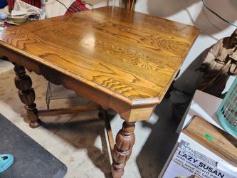 Antique Wood Table with ornate bib and 6 ornate legs. 
50" Long x 38"w x 30.5"h