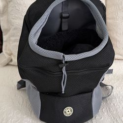 $25 Brand new Dog carrier front or rear back backpack. Holds 15 to 20 pound dog.