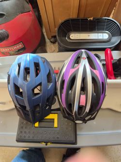 Two Bike Helmets – Blue and Schwinn Purple