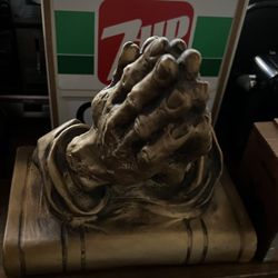 Praying Hands On Bible Sculpture