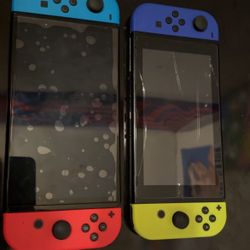 Two Nintendo Switches + 2 Mario Games