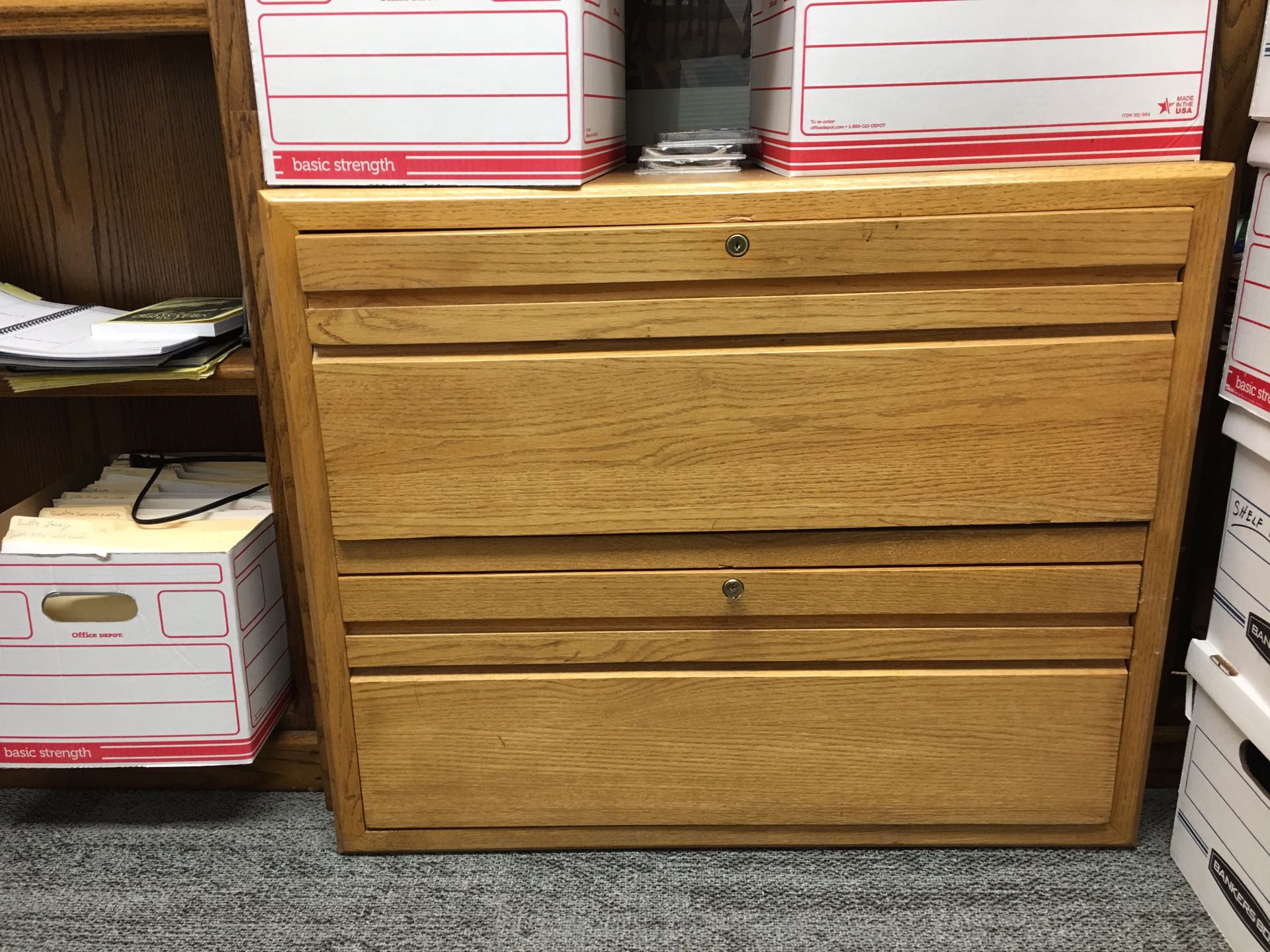 Two drawer, oak lateral file cabinet.