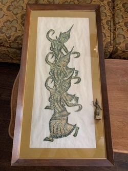 Gold painting with matching brass figure