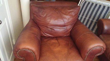 A brugandy leather sofa chair