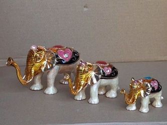 Three decorative miniature elephants