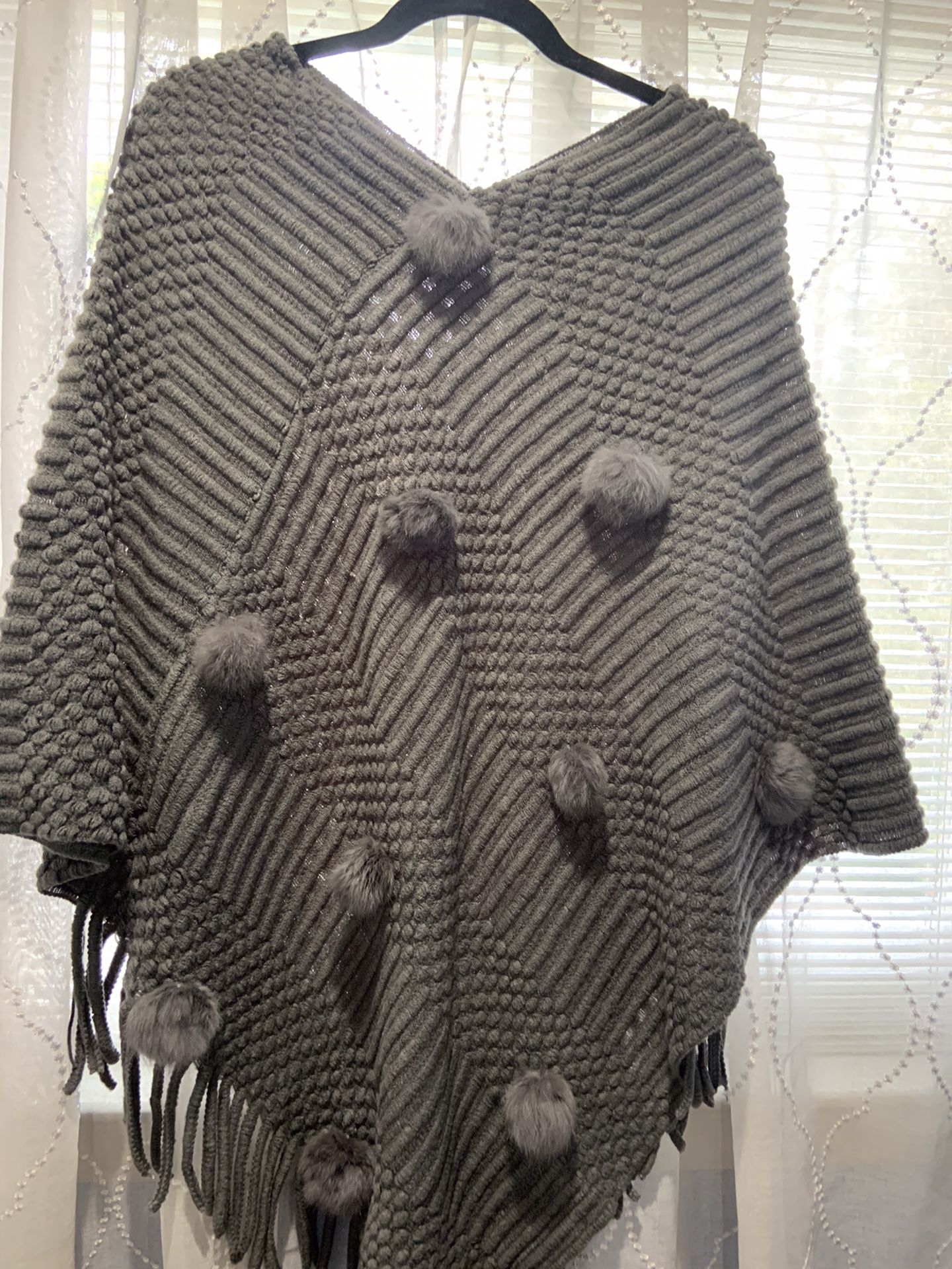 Very nice. Poncho in brown with pon-pon new