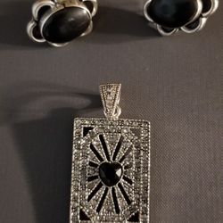 Sterling silver with black onyx and cubic zirconia