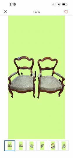 Pair of antique style Victorian balloon back armchairs, likely constructed from mahogany