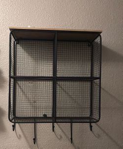 Shelf organizer with hooks.