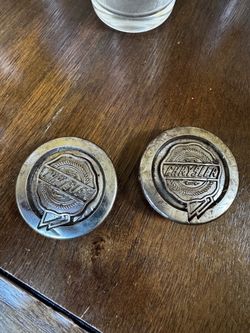 2 Chrysler center Wheel caps