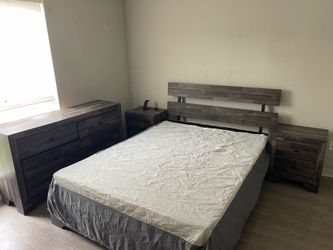 Queen size bedroom set up with 2 nightstands and a large drawers w/box spring for $100