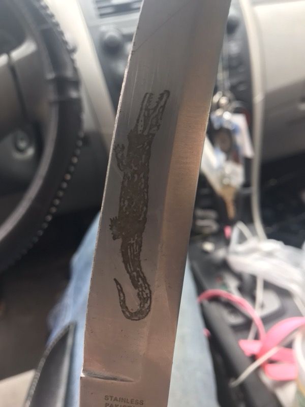 Antique stainless Pakistan steel knife with alligator design