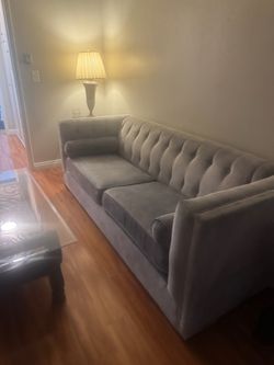 Bluish gray tufted sofa