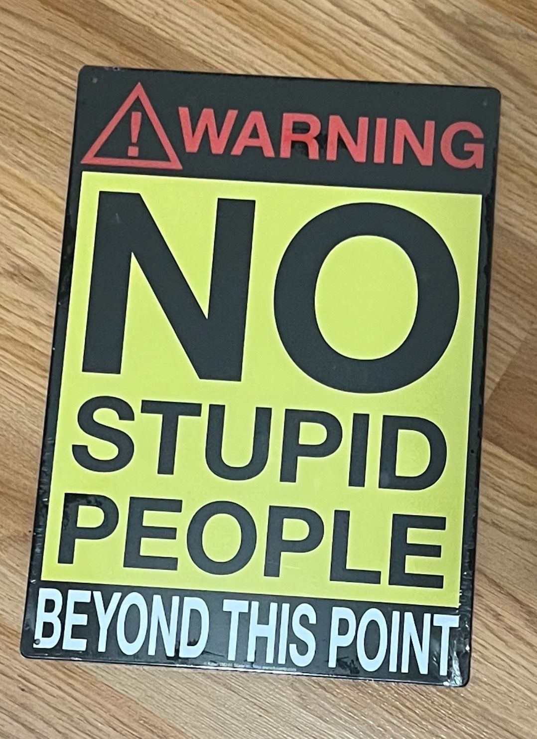 Warning no stupid people beyond this point tin poster