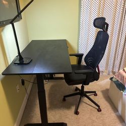 Electric standing desk with memory and office chair