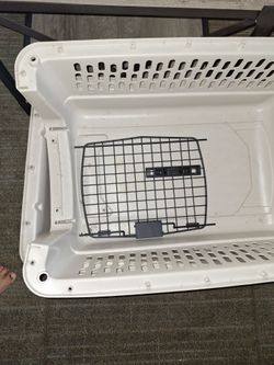 Cage for a dog.