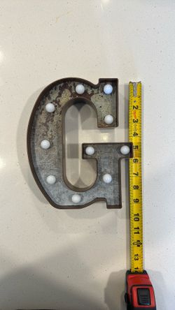 Illuminated “G”