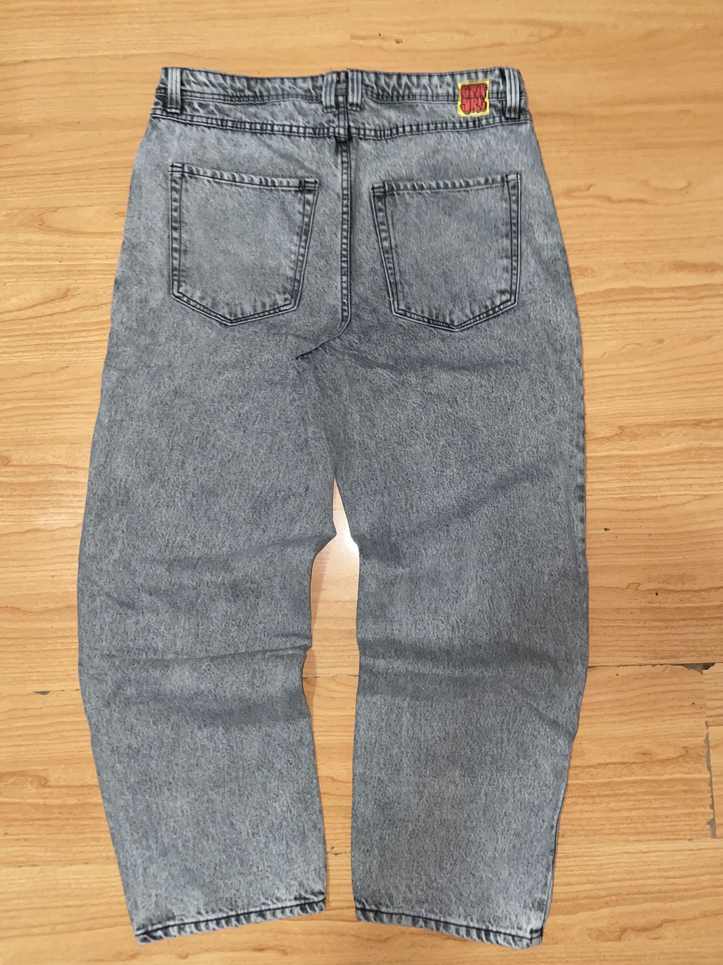 Grey and black acid wash denim jeans