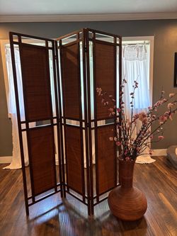 Japanese panel room divider with wooden vase with cherry blossom stems