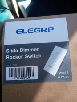 Slide dimmer rocker switch
