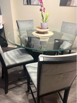 Glass dining table with chairs