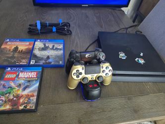 Sony PlayStation 4 Slim Bundle with 2 Controllers, 3 Games, and Charging Dock