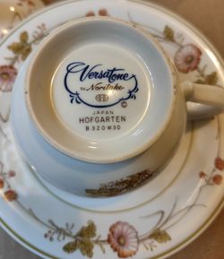 4 sets of Noritake tea cup and saucers, and a sugar bowl comes with lid