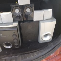 A bunch of  small speakers and subwoofer 
