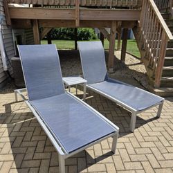 Two Pool Lounge Chairs And Side Table