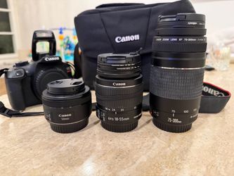 Canon EOS Rebel T6 DSLR Camera with 3 lenses, 9 filters, 2 lens attachments (telephoto & wide angle), cleaning kit, and case