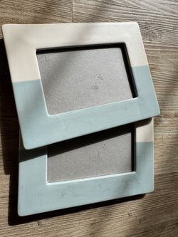 Two beautiful matching ceramic blue and white picture frames 
