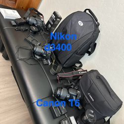 Canon And Nikon Cameras $300.00 Each 