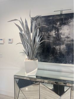Modern silver plant with white base