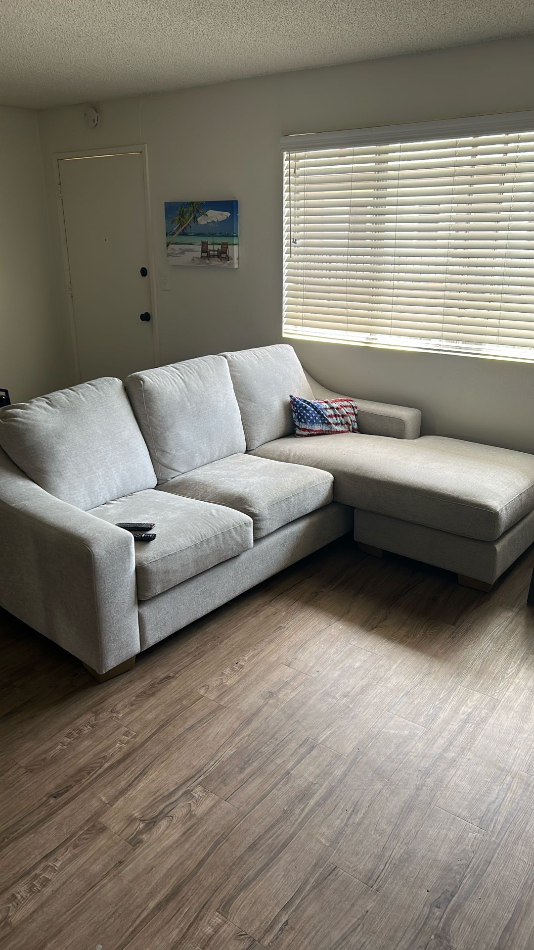 Couch With Reversible Leg Rest Cushion
