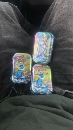 Prismatic Evolutions Tins