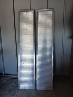 Loading ramps 6feet by 3 feet strong 12  pound capacity great for bikes an other equipment  still new