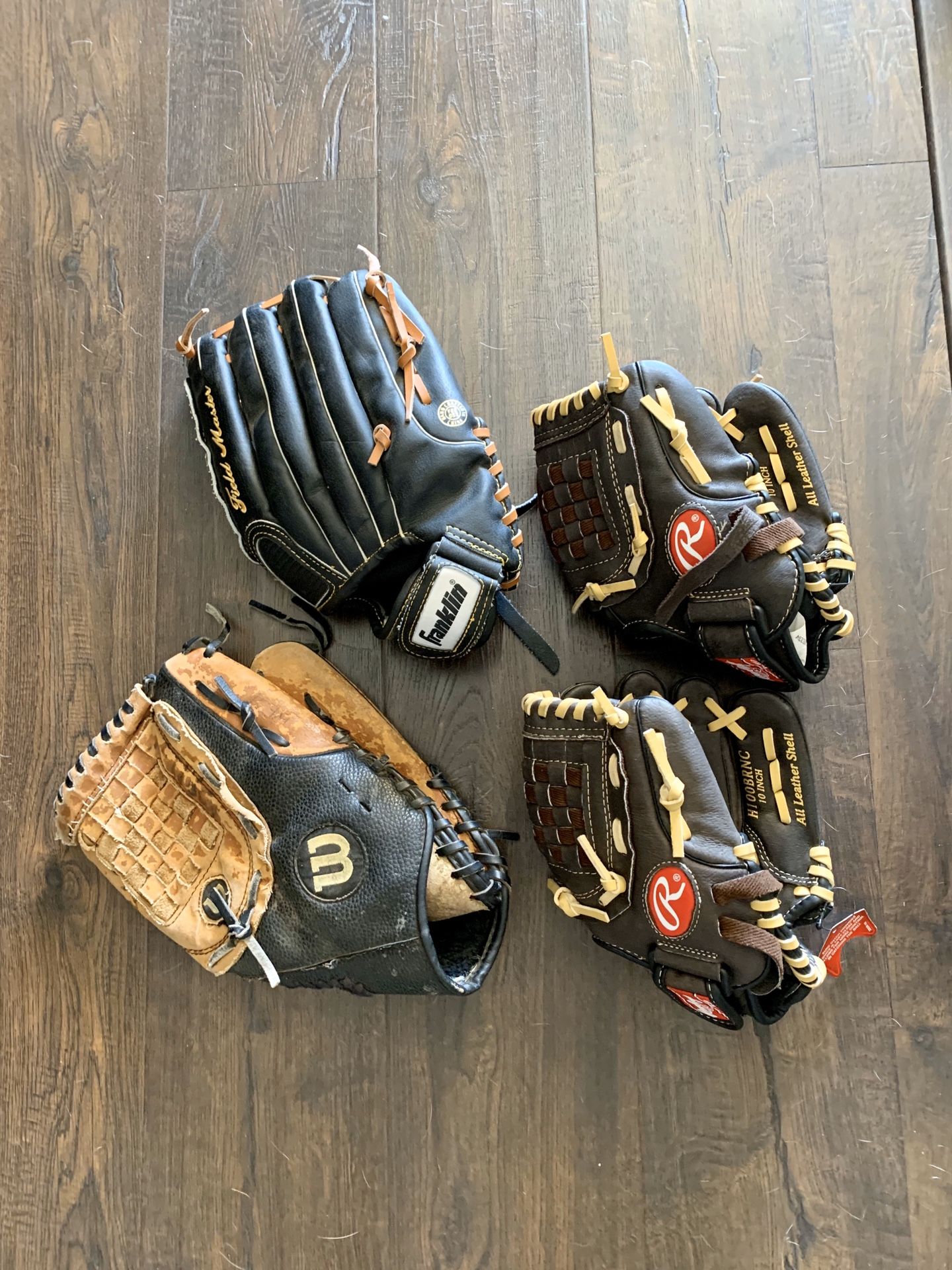 4 baseball gloves and 4 bats $65