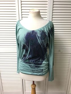 Size small, long sleeve shirt, peacock feather patter with pleated sides